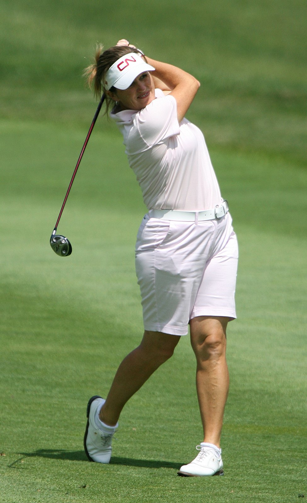 Lorie Kane at the 2007 LPGA Championship in a white visor, pale pink polo and white shorts